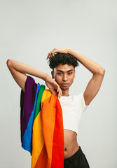 Gender fluid man posing with lgbt flag