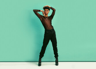 Gay man posing in black outfit