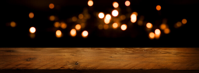 Festive bokeh with rustic table
Festive golden bokeh with empty rustic wooden table. Horizontal...