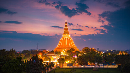 Large golden pagoda Located in the community at sunset , Phra Pathom Chedi , Nakhon Pathom province, Thailand. This is  public property, no restrict in copy or use.