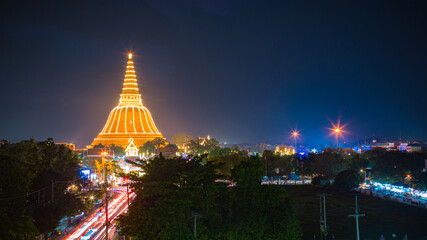 Large golden pagoda Located in the community at sunset , Phra Pathom Chedi , Nakhon Pathom province, Thailand. This is  public property, no restrict in copy or use.