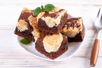 Trend baking Brookies chocolate brownies and cookies homemade cake sliced by squares in a white plate