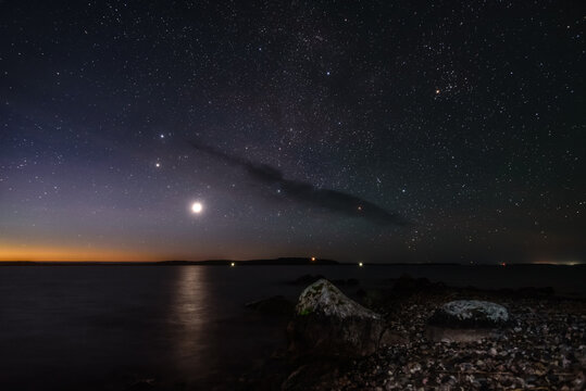Bright light of Venus in the night sky over Lake Onega. Russia, Republic of Karelia
