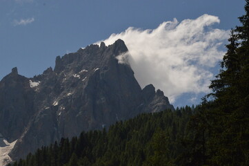 Hiking in the lush and dramatically beautiful Val di Fiemme and Passo Rollo in the Dolomites,...