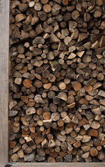 Stacked stack of firewood on the street