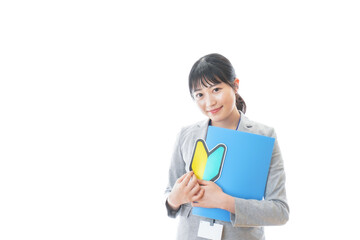 Fototapeta premium 初心者マークを持つ若いビジネスパーソン