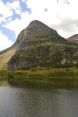 Fototapeta premium Hiking and climbing in the stunning valleys and mountains of Val di Fiemme in the Dolomites, Italy