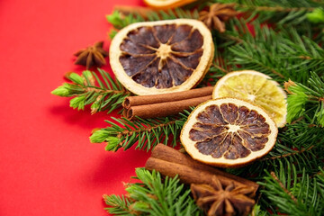 Composition with christmas tree branches, dry orange slices, cinnamon and anise spices