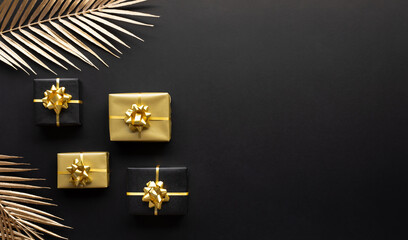 Celebration concepts with gold gift box decoration with mock up leaf on dark background