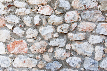 Antique stone wall. Old bricks background.
