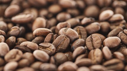 Coffee beans pile background closeup