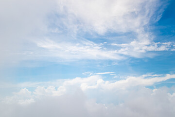 White fluffy cloud on blue sky background.