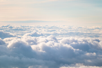 View at sunrise with puffy foggy. White puffy like cloud stretching to foggy horizon in the bright morning.