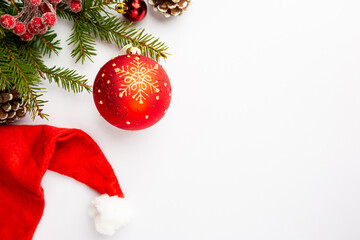 Obraz premium Christmas holidays composition with red balls on white background with copy space for your text