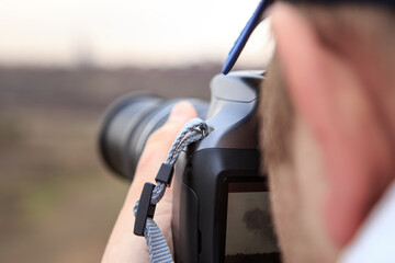 The photographer takes pictures of nature in open space