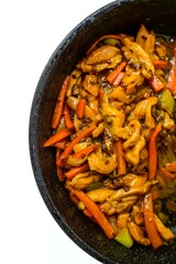 Chinese cuisine. Chicken in sweet and sour sauce with pepper in a frying pan on a white background. The kitchen of the world.