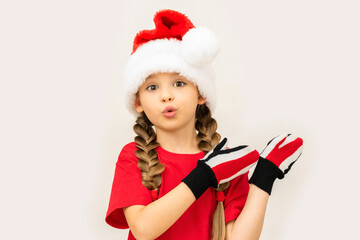 A child in a Christmas hat on a white background .