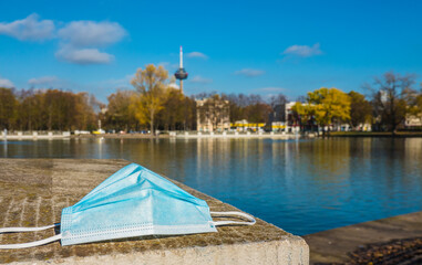 Cologne Koln Germany, Corona Covid Time: Panorama of the Aachener Weiher Lake with Protection Mask