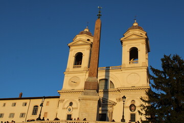 Fototapeta premium obelisk and bell tower at famous landmark spanish steps rome italy