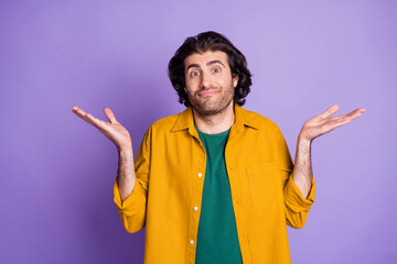 Photo of young handsome unsure uncertain puzzled man male guy hold hands don't know isolated on...