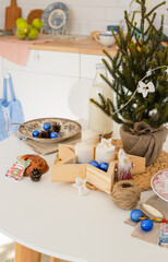 Preparing Christmas decorations. Christmas decor. White Scandinavian table with Christmas decoration. Christmas mood.