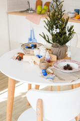 Preparing Christmas decorations. Christmas decor. White Scandinavian table with Christmas decoration. Christmas mood.