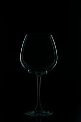 Naklejka na ściany i meble photo of a glass on a dark background
