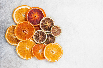 Dried citrus fruits composition with orange and lime. Creative christmas concept.
