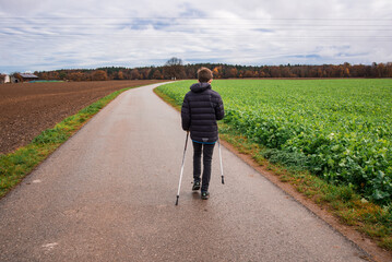 Teenager doing nordic walking