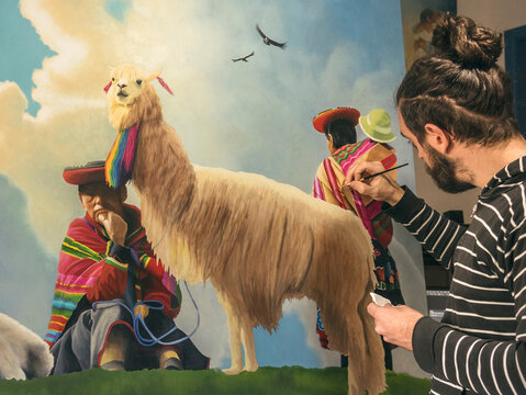 Male artist painting latin american people