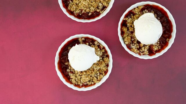 Adding Vanilla Ice Ream to Cherry Crisp