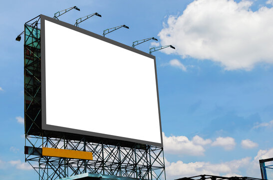 Blank Canvas Billboard White Screen Design For Display Advertising Banner Outdoor. Large Mockup Ad Banner With Blue Sky And Cloud.