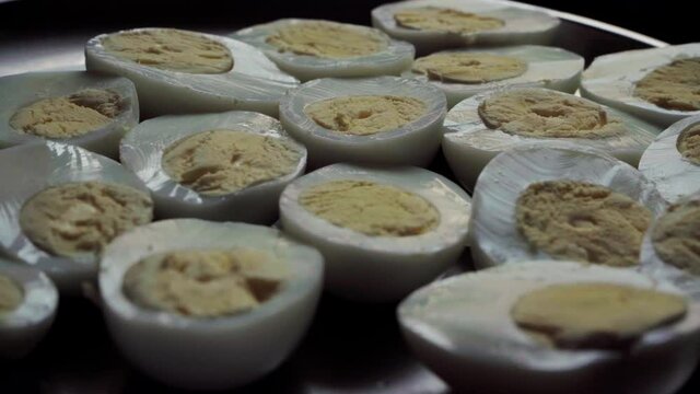 boiled egg half cunted in plate India yellow yoke egg white
