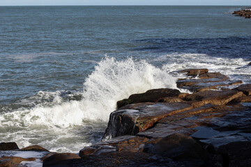 waves crashing on rocks