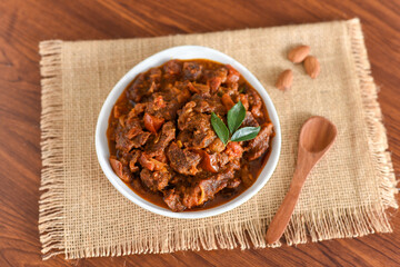 Spicy beef curry. Goan style beef vindaloo. Traditional Indian Lamb or beef curry . spicy Beef curry gravy popular in Kerala Sri Lankan Goa for Appam, Parotta porotta in India.