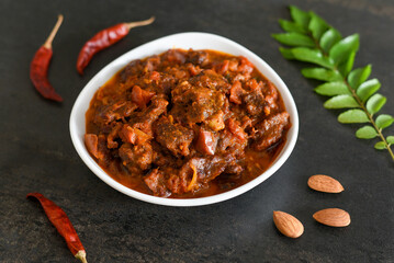 Spicy beef curry. Goan style beef vindaloo. Traditional Indian Lamb or beef curry . spicy Beef curry gravy popular in Kerala Sri Lankan Goa for Appam, Parotta porotta in India.