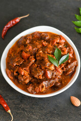 Spicy beef curry. Goan style beef vindaloo. Traditional Indian Lamb or beef curry . spicy Beef curry gravy popular in Kerala Sri Lankan Goa for Appam, Parotta porotta in India.