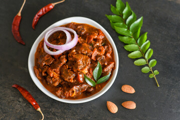 Spicy beef curry. Goan style beef vindaloo. Traditional Indian Lamb or beef curry . spicy Beef curry gravy popular in Kerala Sri Lankan Goa for Appam, Parotta porotta in India.
