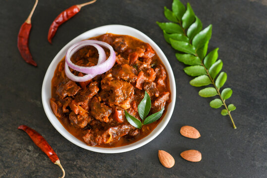 Spicy beef curry. Goan style beef vindaloo. Traditional Indian Lamb or beef curry . spicy Beef curry gravy popular in Kerala Sri Lankan Goa for Appam, Parotta porotta in India.