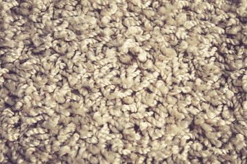 Carpet fibers close up. brown carpet texture, top view.