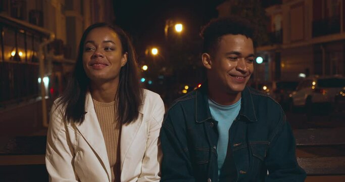 Shy girlfriend and boyfriend smiling to each other, flirting on date, first love