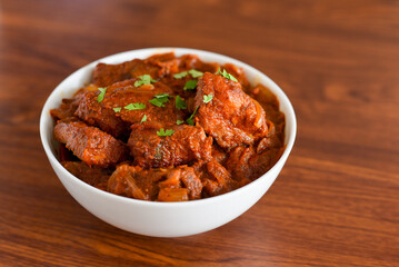 Spicy red fish curry  Goan style fish vindaloo ,  chilly  fish curry Indian Food curry Goa India . spicy Kerala Bengali fish curry side dish for Appam, rice , roti , chapati