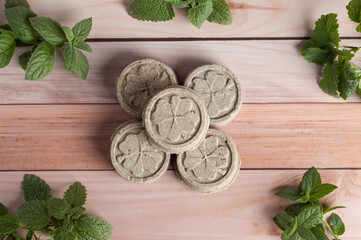 Eco friendly natural solid shampoo and hair conditioner on wooden background. Concept animal fat free, zero waste.
