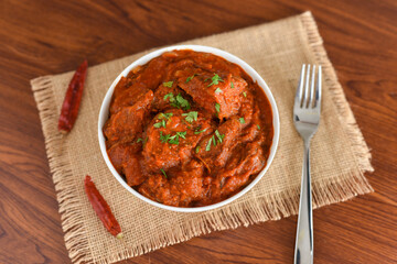 Spicy red fish curry  Goan style fish vindaloo ,  chilly  fish curry Indian Food curry Goa India . spicy Kerala Bengali fish curry side dish for Appam, rice , roti , chapati