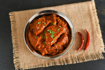 Spicy red fish curry  Goan style fish vindaloo ,  chilly  fish curry Indian Food curry Goa India . spicy Kerala Bengali fish curry side dish for Appam, rice , roti , chapati