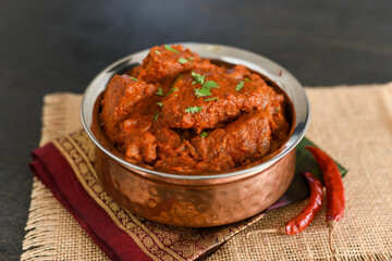 Spicy red fish curry  Goan style fish vindaloo ,  chilly  fish curry Indian Food curry Goa India . spicy Kerala Bengali fish curry side dish for Appam, rice , roti , chapati