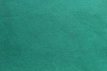 Fototapeta premium Green background with fabric texture is suitable for new year and Christmas compositions