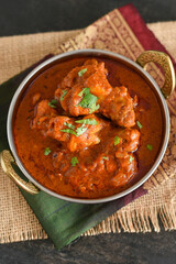 Spicy red chicken curry. Goan style chicken vindaloo. Butter chicken Murgh Makhani curry roast hot and spicy gravy dish Dhaba Punjab, India. North Indian non-vegetarian cuisine Garam Masala. tikka