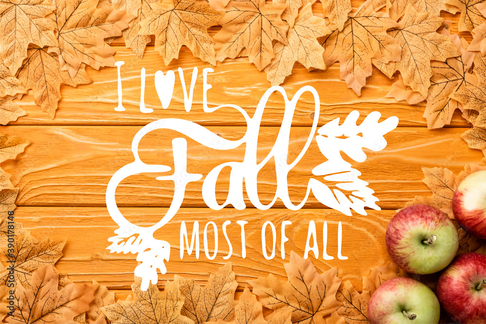 Wall mural top view of ripe apples and autumnal foliage near i love fall most of all lettering on wooden background - Wall murals