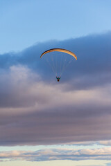 Paragliding against snow-capped Andes mountains during winter season in Esquel, Patagonia, Argentina